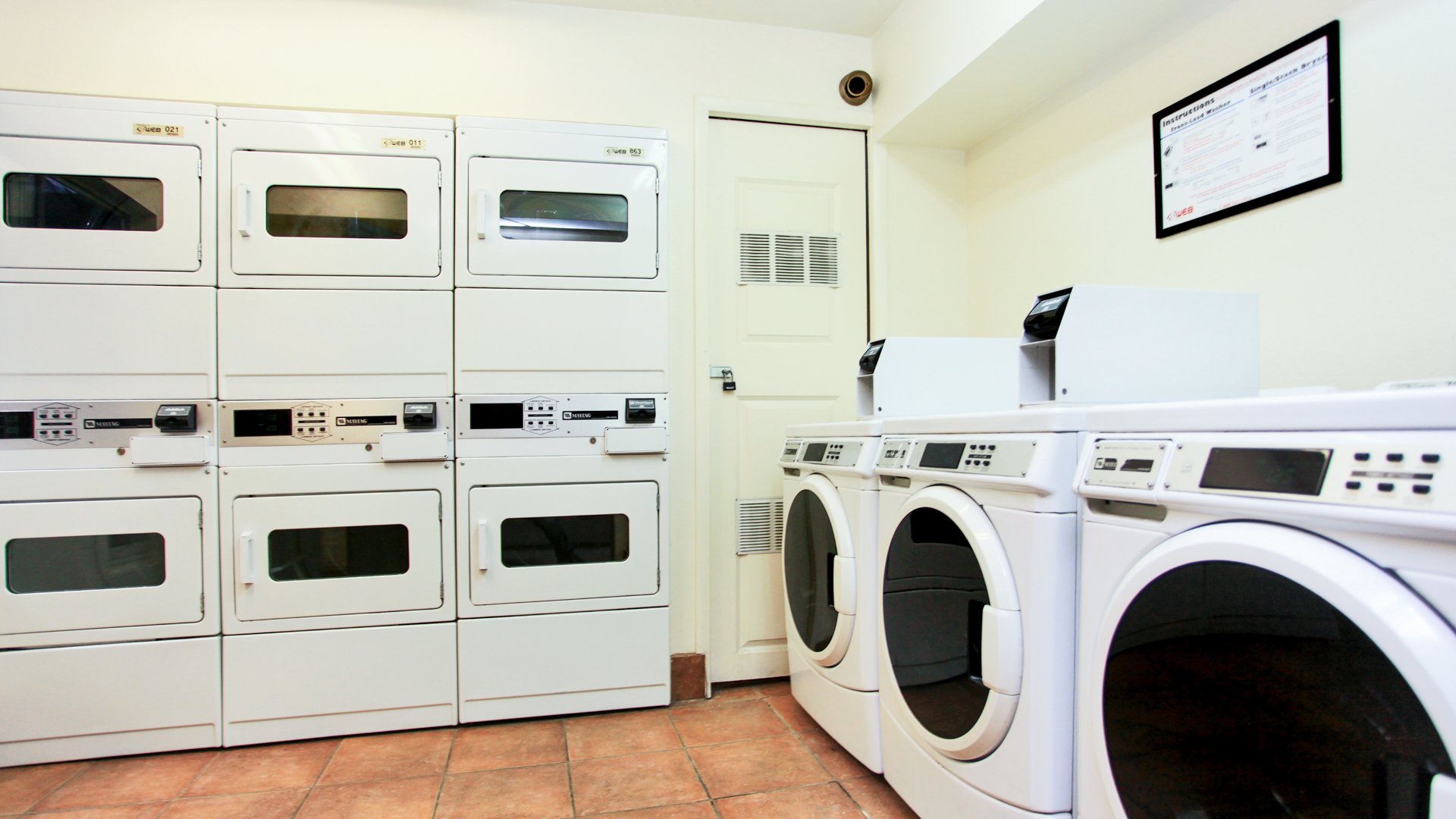 Laundry room at The Cleo Apartments
