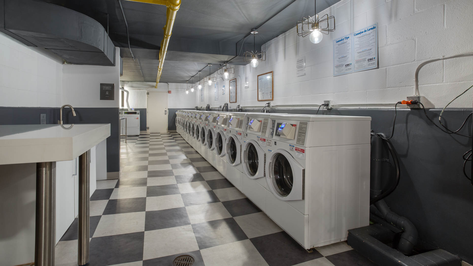 Laundry room at 1500 Mass Apartments (1 of 2)
