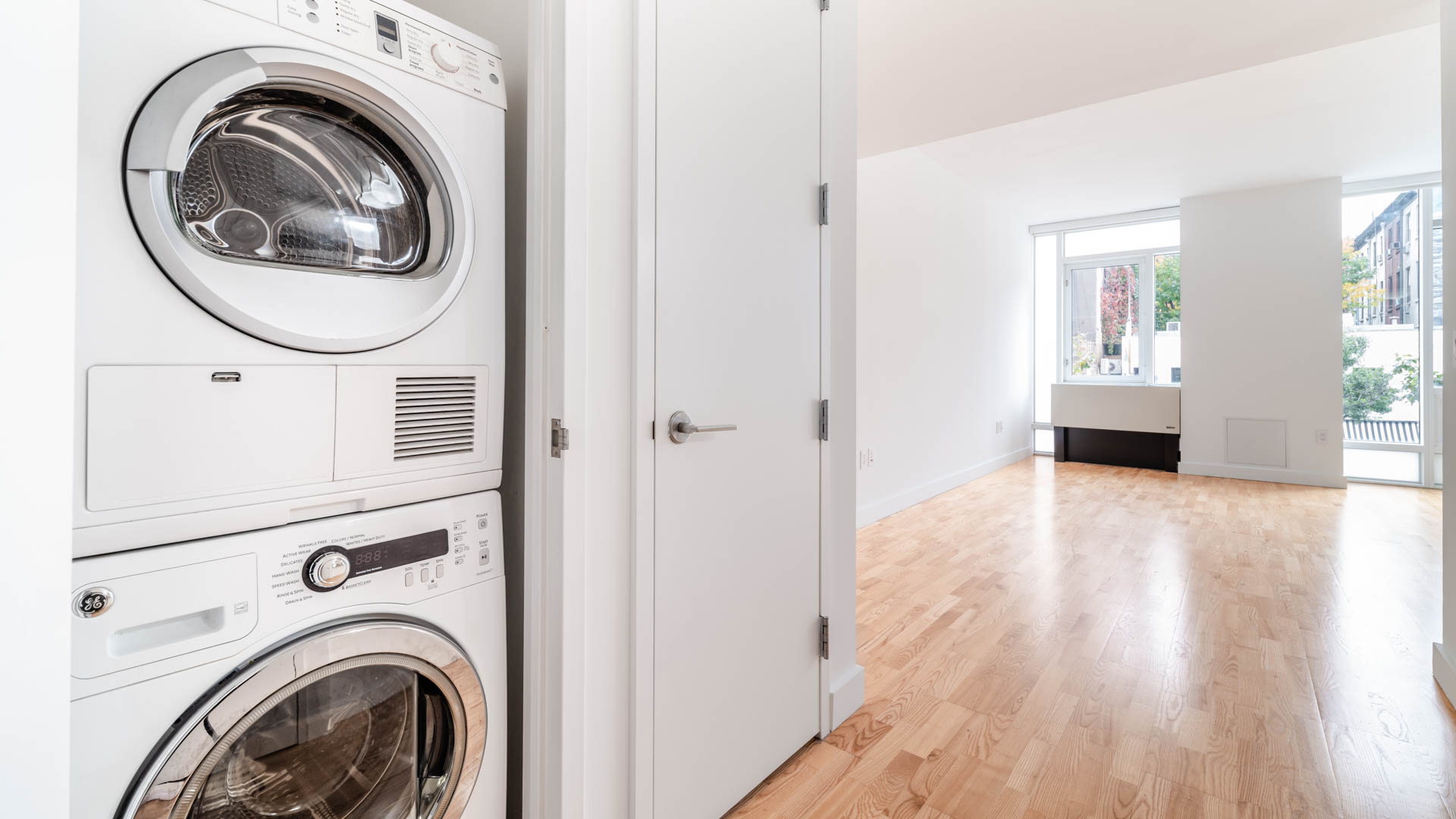 Laundry room at Ten23 Apartments