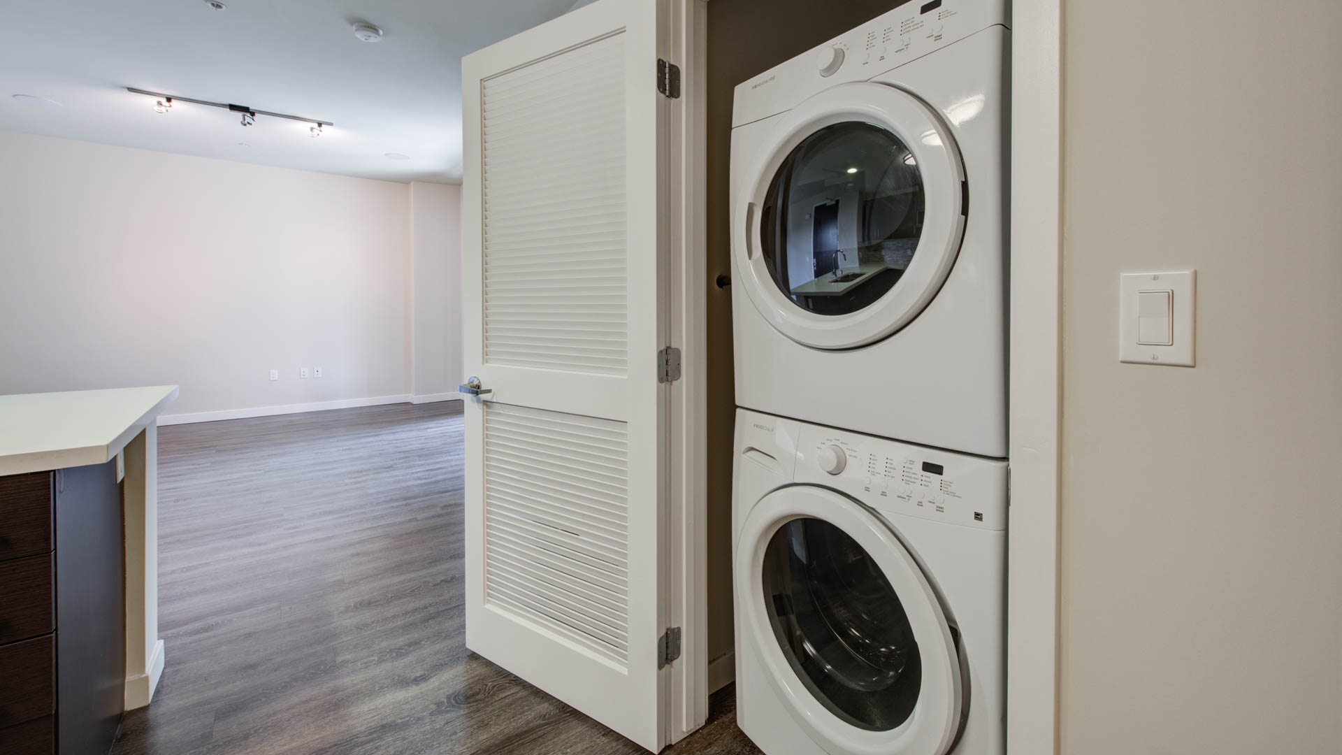 Laundry room at Radius Koreatown Apartments