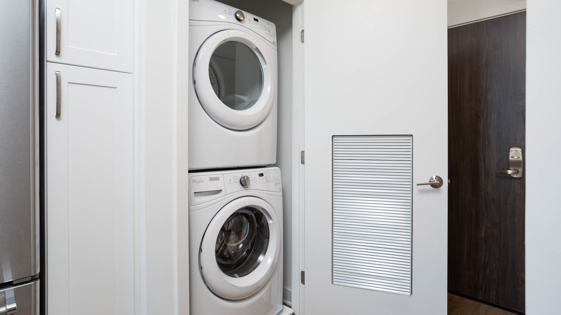 Laundry room at 100K Apartments
