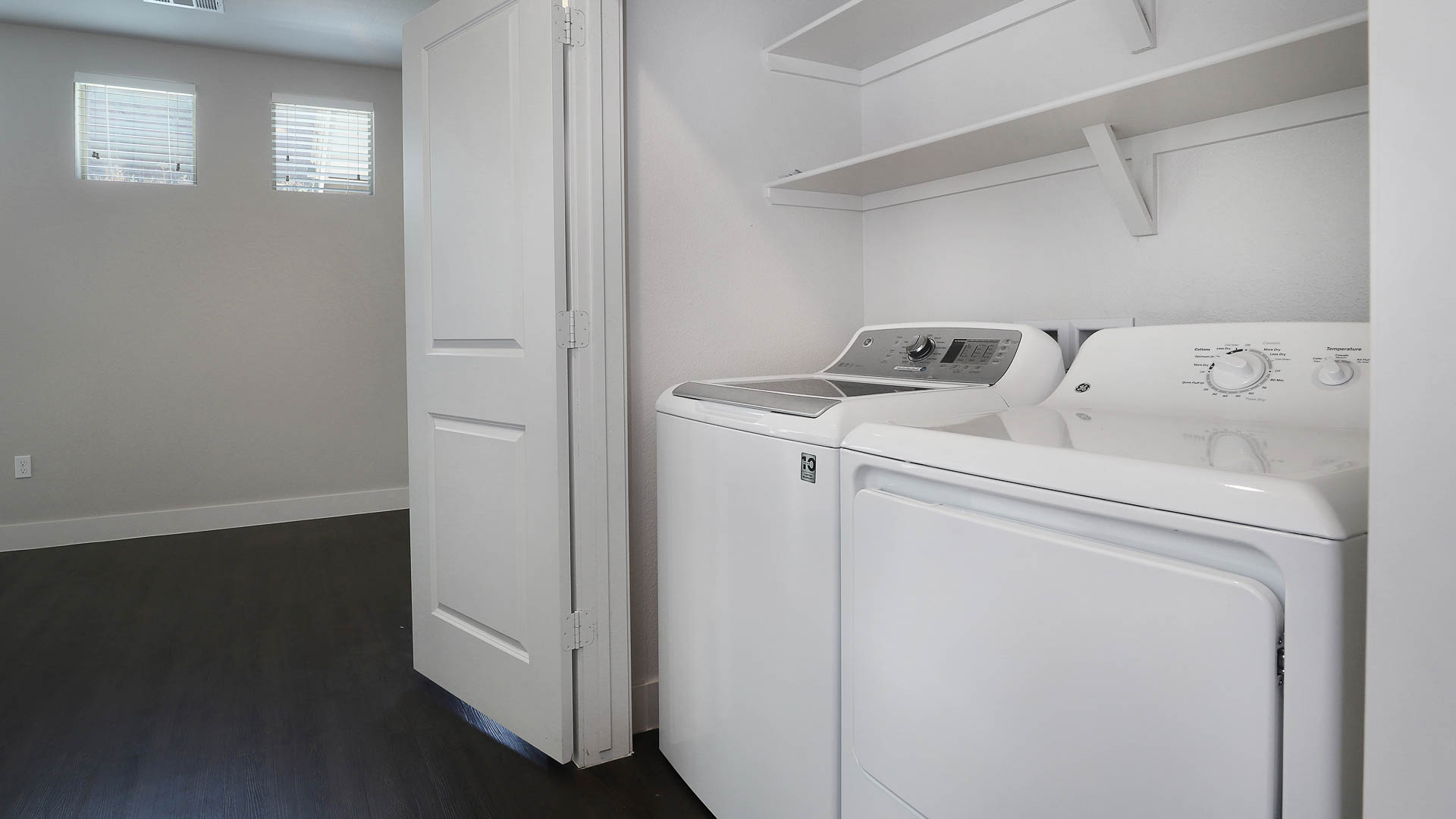 Laundry room at Venue at the Promenade Apartments