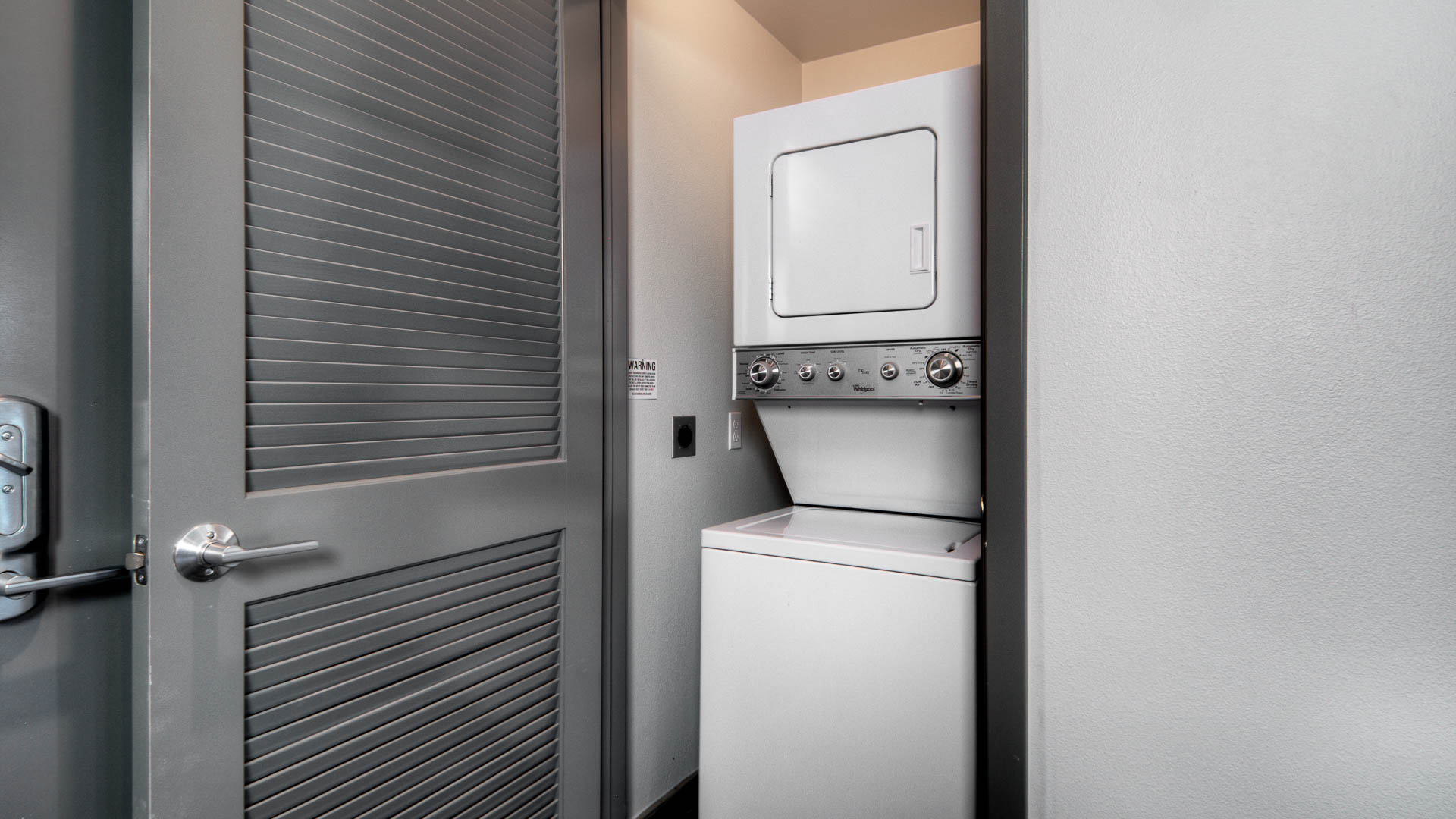 Laundry room at The Lex Apartments