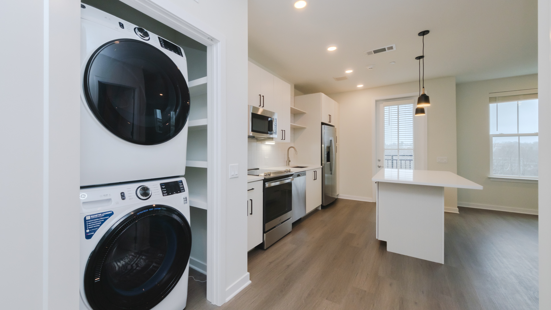 Laundry room at Alexan Harrison Apartments (3 of 4)