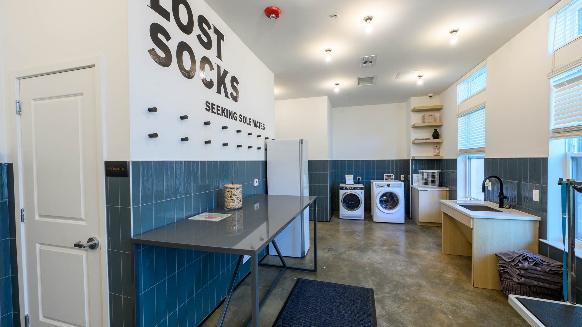 Laundry room at Iris O4W Apartments