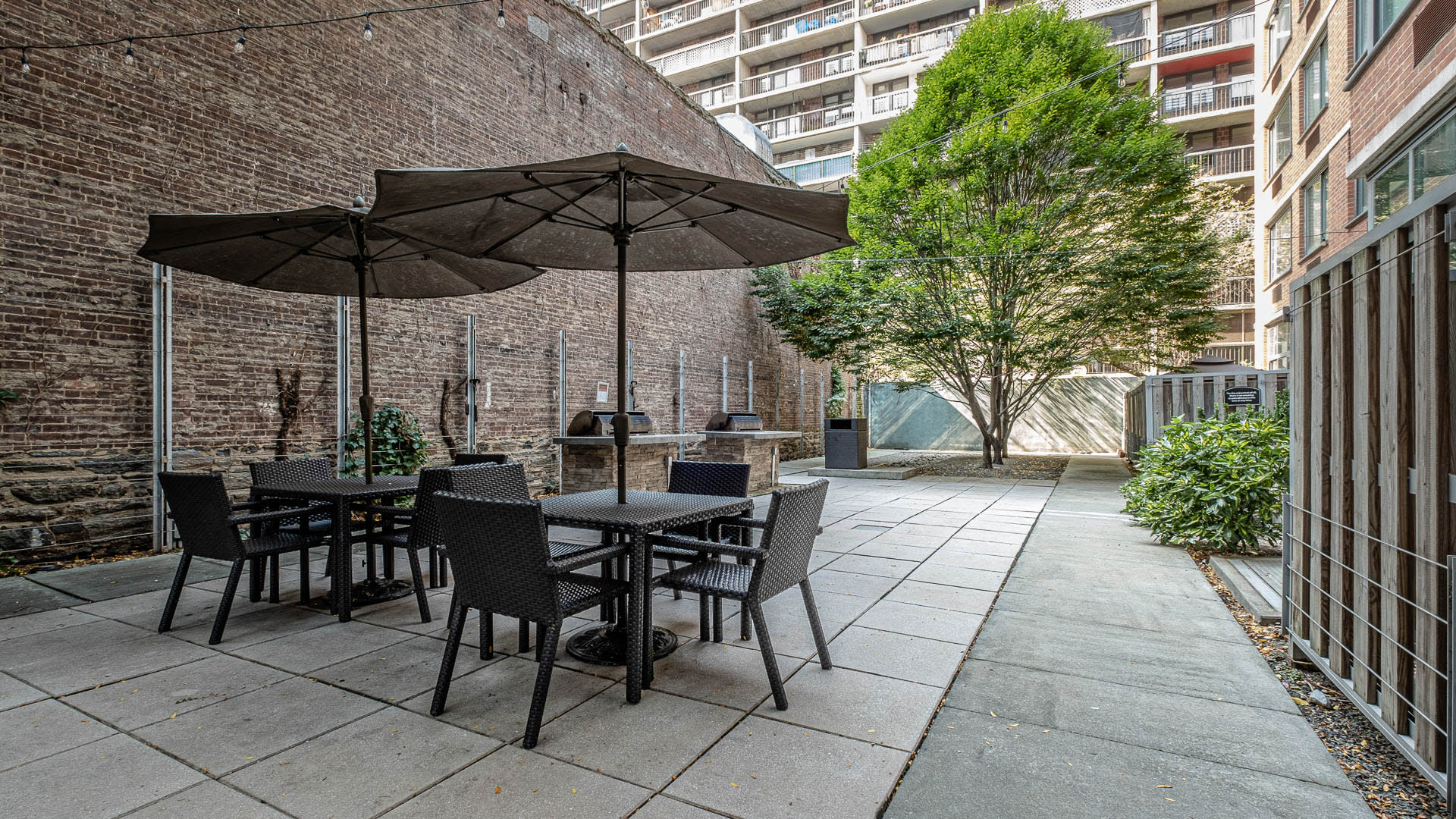 West 54th Apartments - Community Patio and Grilling Area
