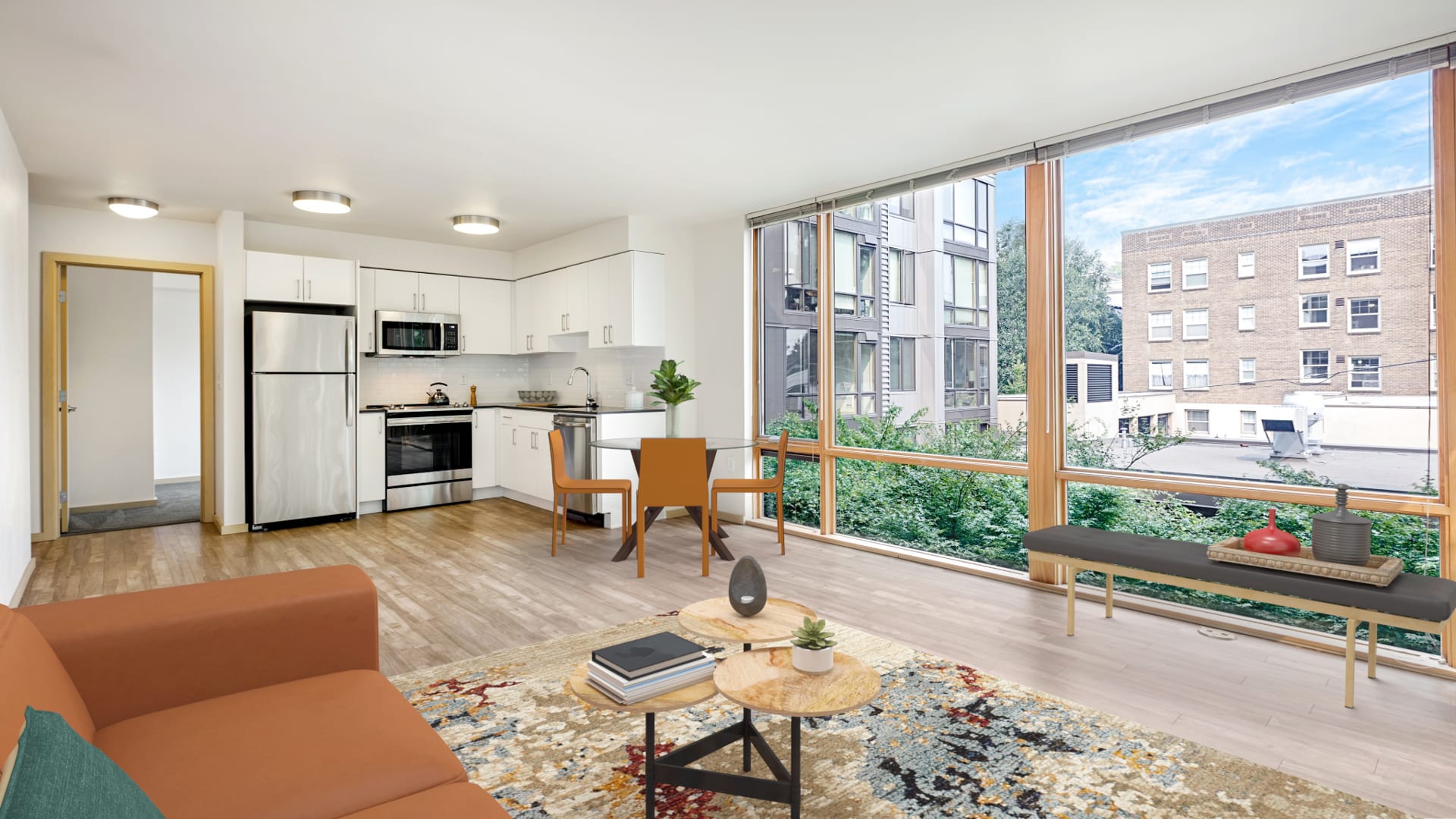 Chloe on Union Apartments - Kitchen and Living Room with Floor-to-Ceiling Windows